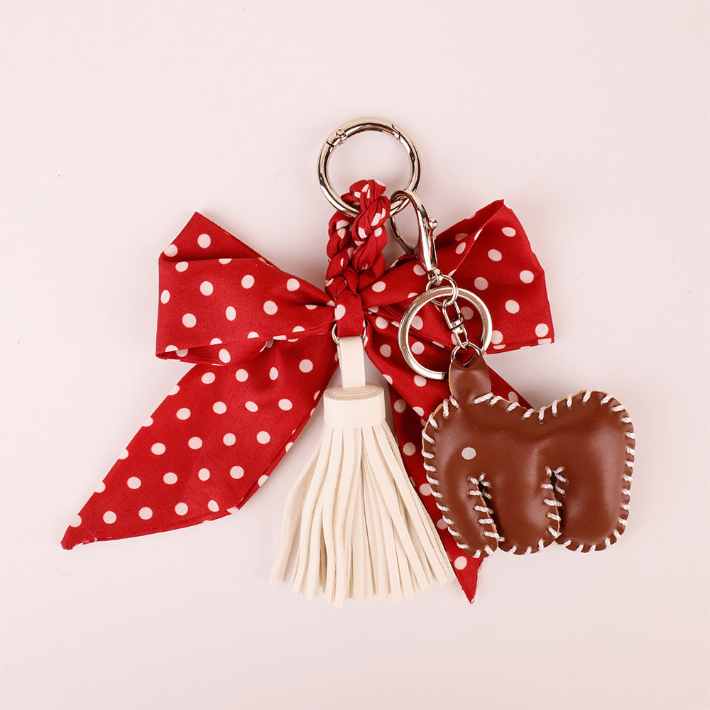Decorative polka dot bow pendant for a women's tote