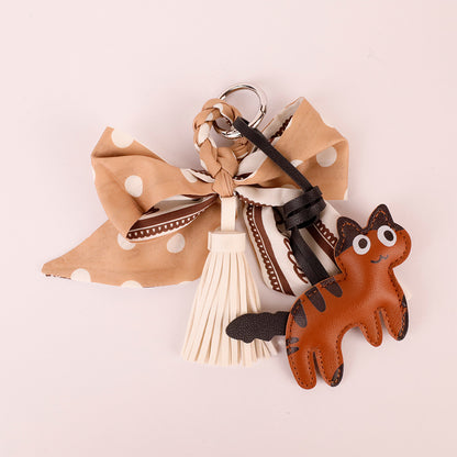 French-inspired tassel hanger for a tote or handbag