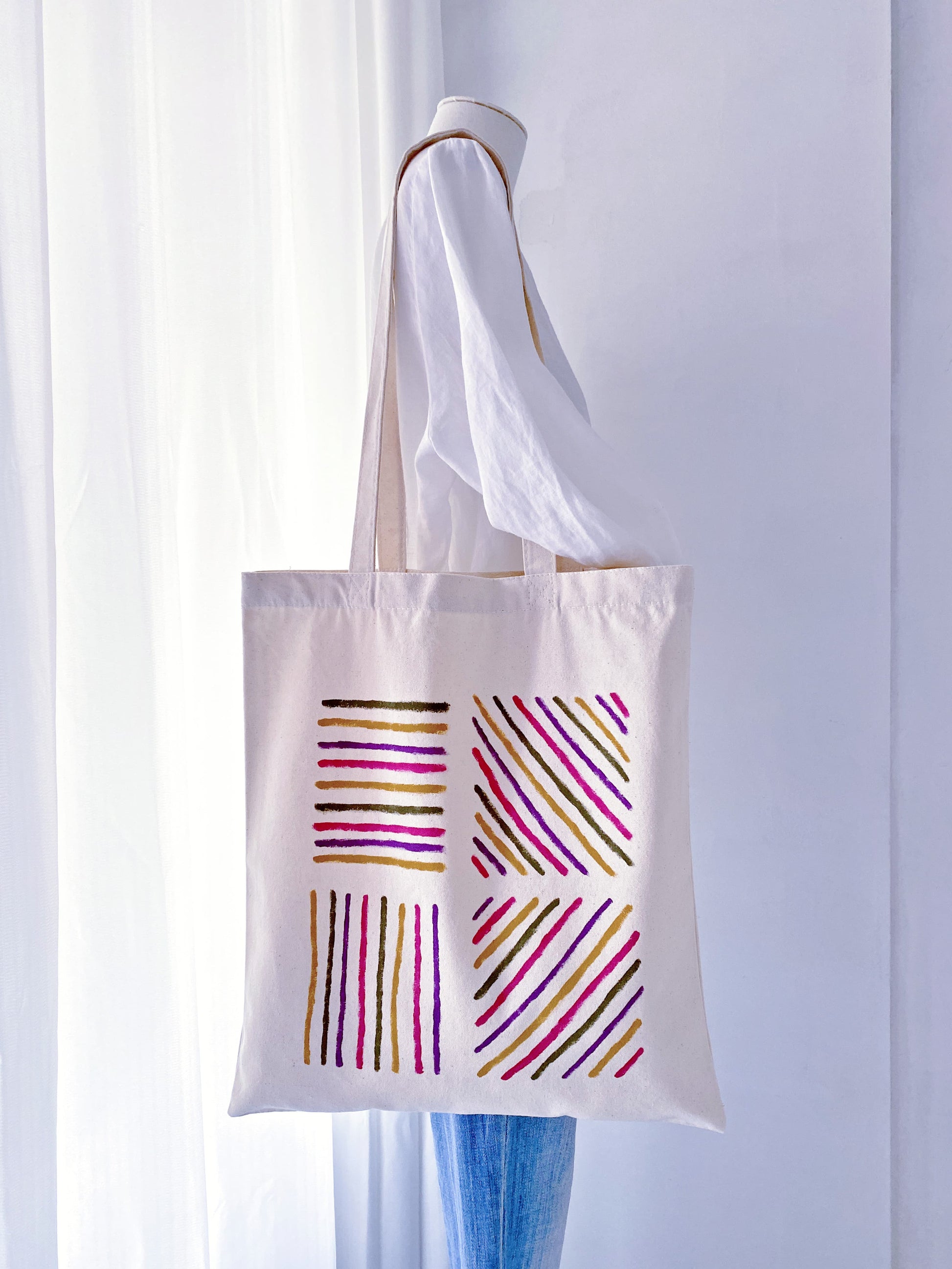 Canvas bag showing a natural fold and soft drape when partially filled.