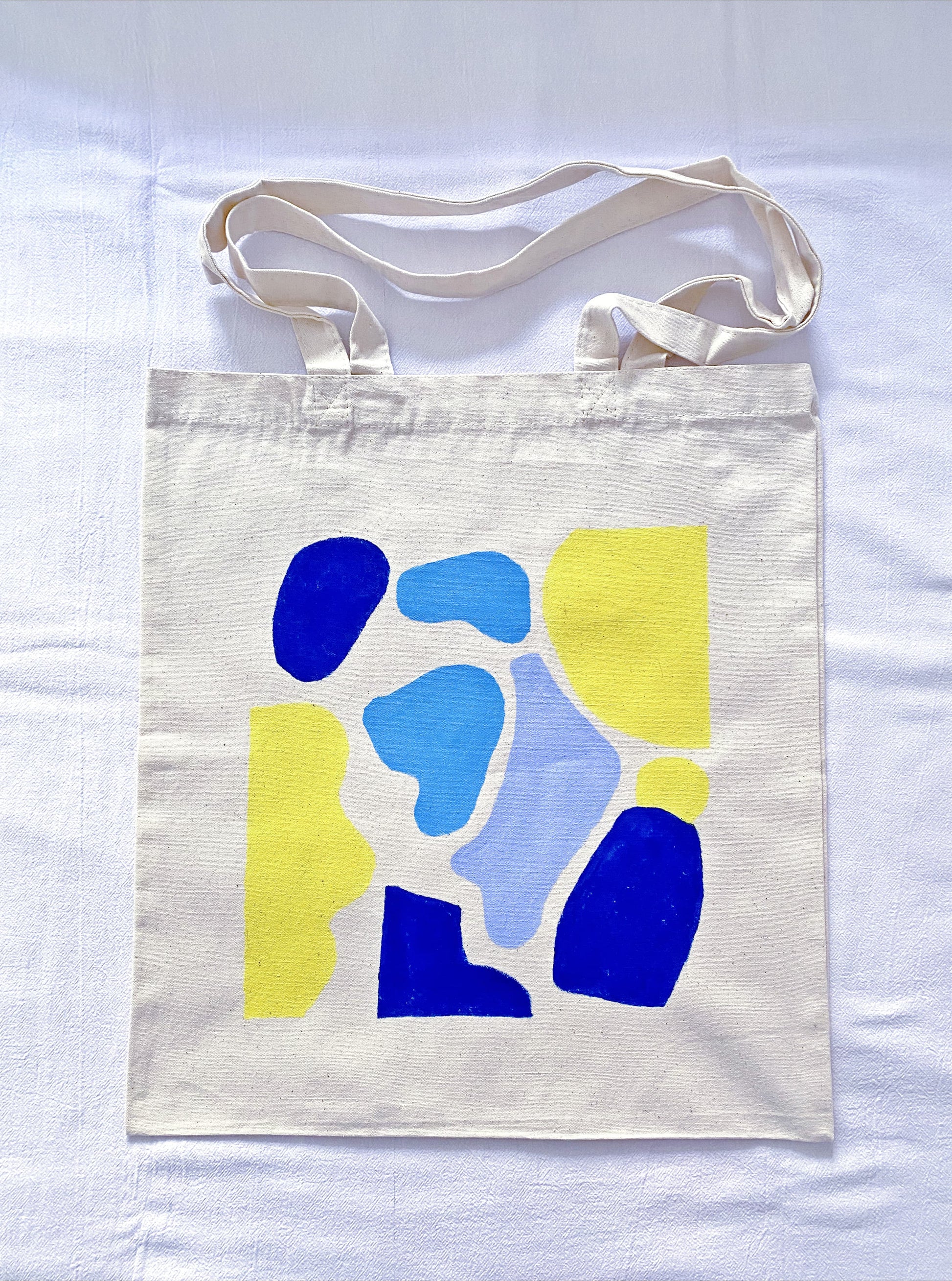 cotton canvas market tote showing a subtle hand-painted illustration