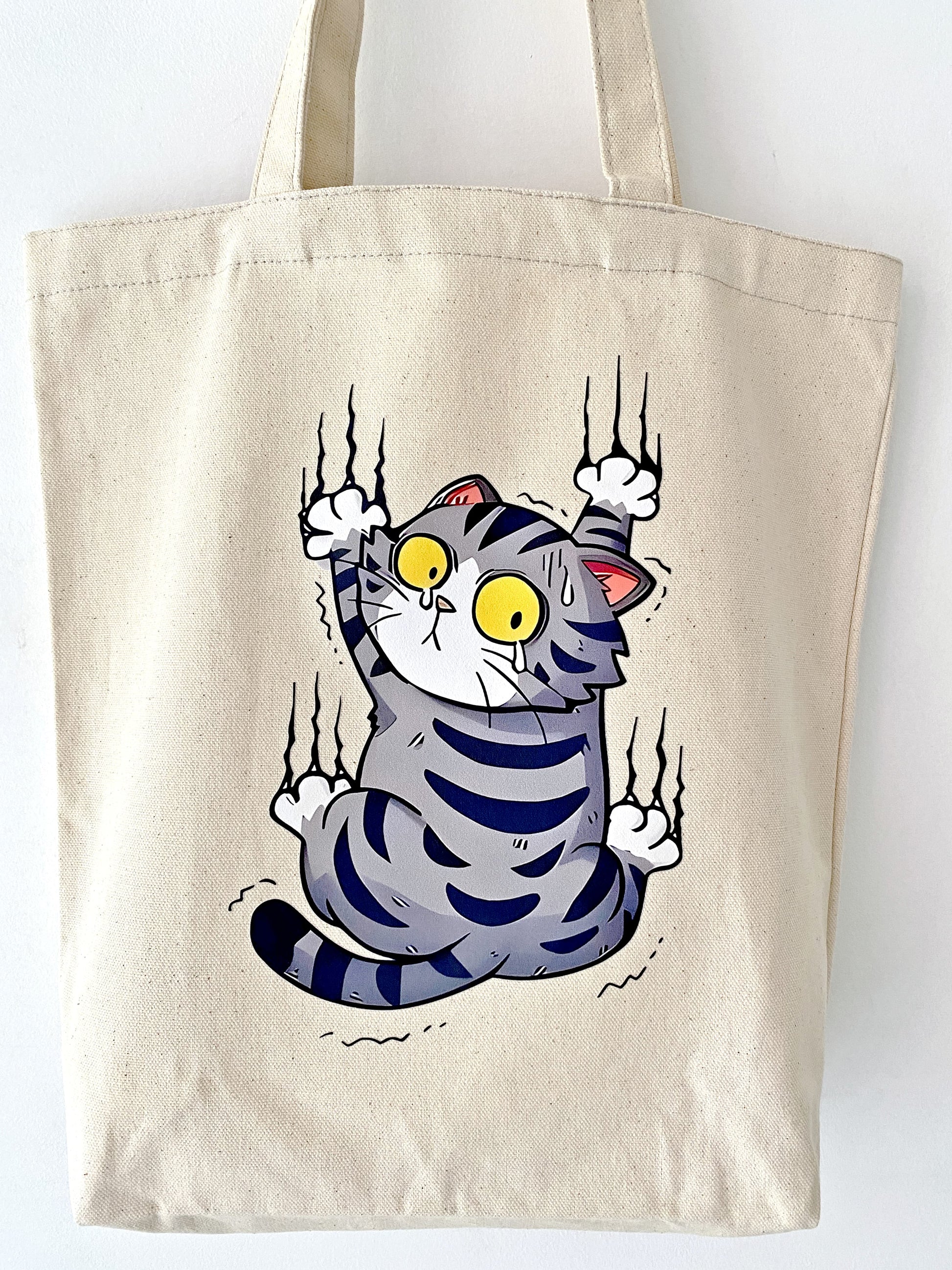 artistic canvas shoulder bag with hand-printed cat motif