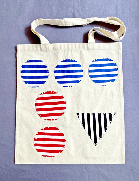 Supersoft cotton shoulder bag with a unique, artistic patchwork finish.