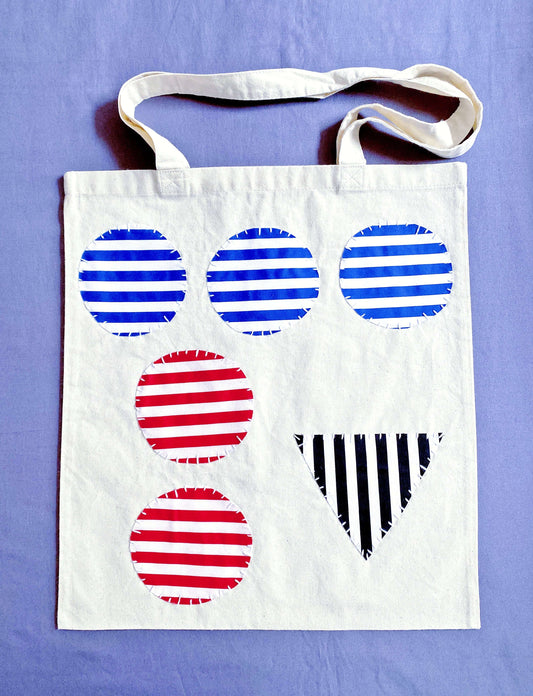 Carrying this soft cotton patchwork tote feels like slowing down on purpose, the kind of bag people reach for when they want a calmer day.