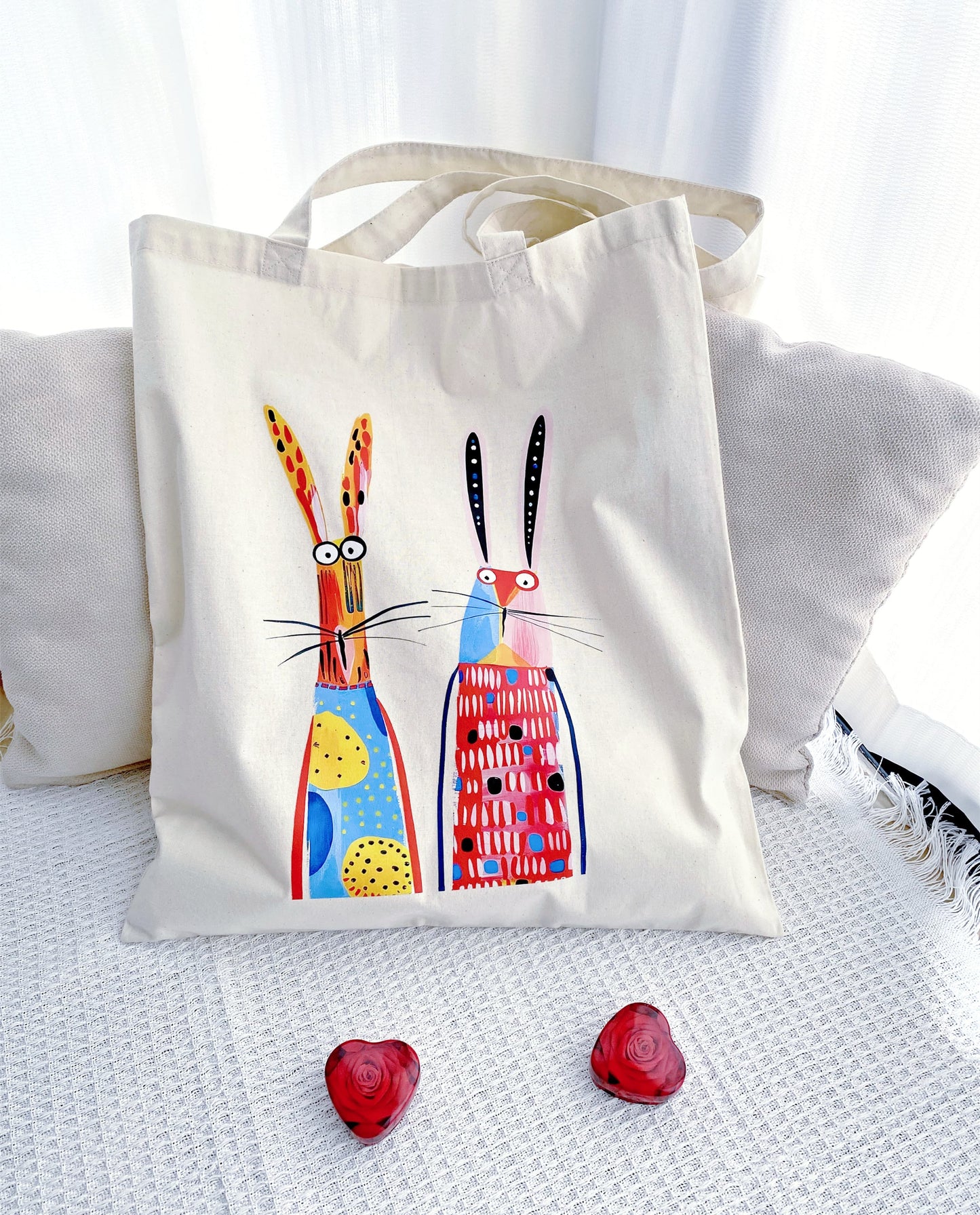 A thoughtful gift for nature lovers featuring a twin bunny print on a soft sustainable fabric background.