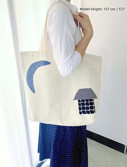 Large fabric bag shown holding books, groceries, and personal items