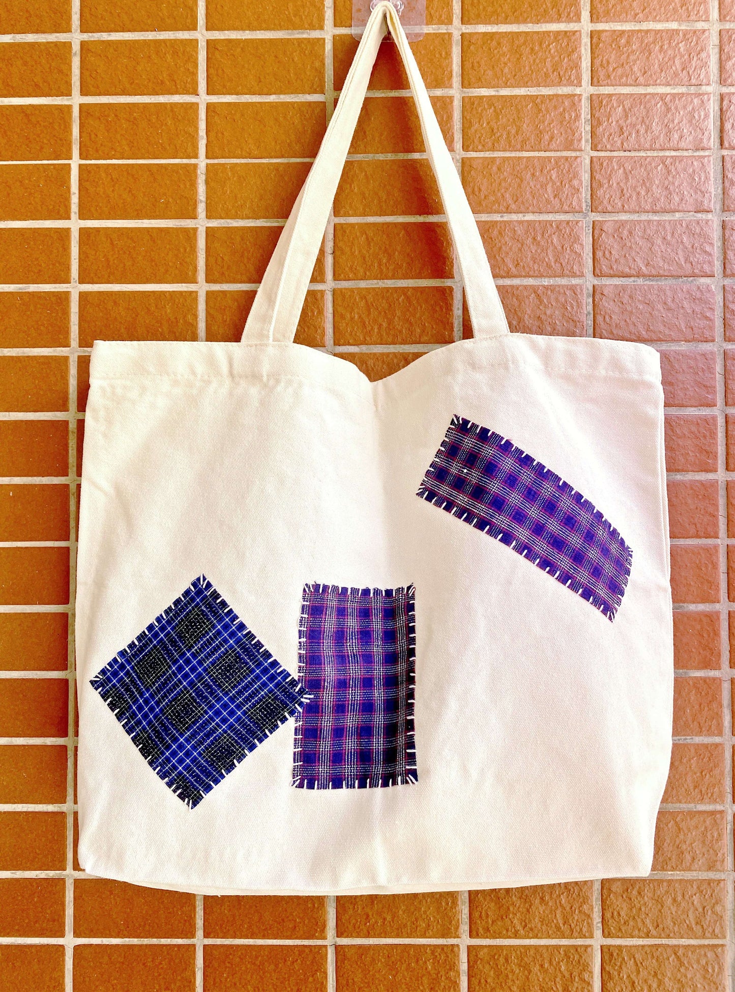 Eco-friendly canvas tote bags with hand-stitched patchwork for sustainable living. Perfect for a casual day out or a unique gift idea.