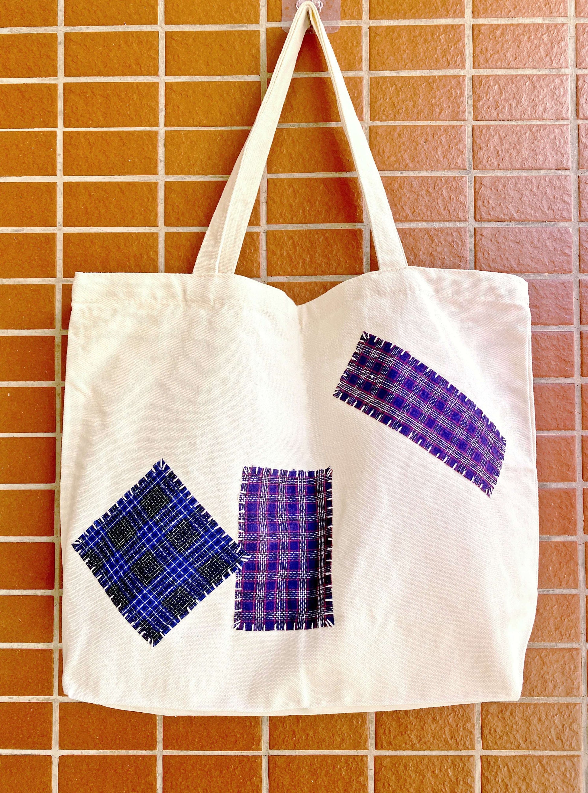 Eco-friendly canvas tote bags with hand-stitched patchwork for sustainable living. Perfect for a casual day out or a unique gift idea.
