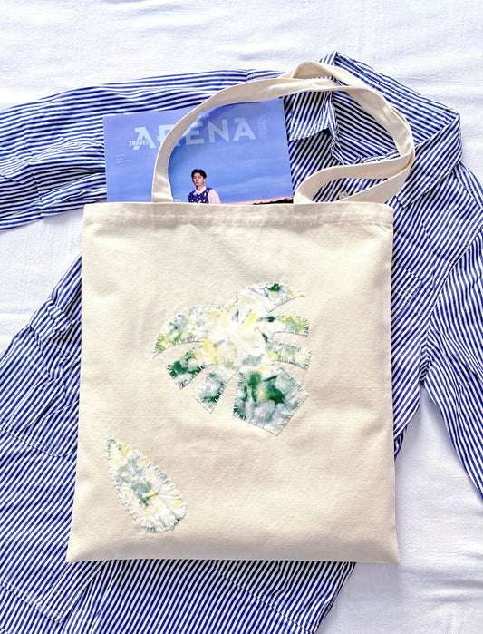 Versatile oversized tote carrying a laptop and books for a slow living cafe afternoon.