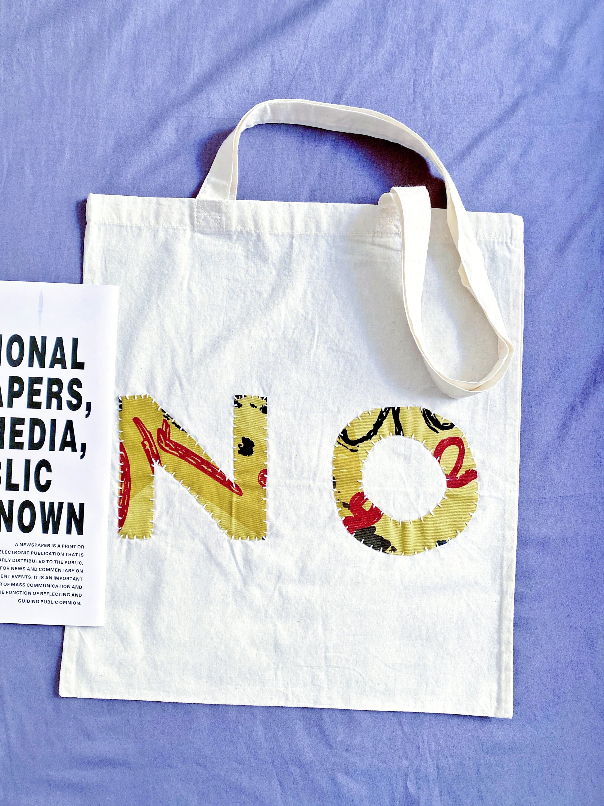 Breathable natural fiber sack with artistic needlework ideal for relaxing weekend getaways or beach picnics