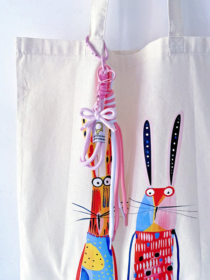 Durable eco-conscious tote filled with fresh market flowers and sourdough.