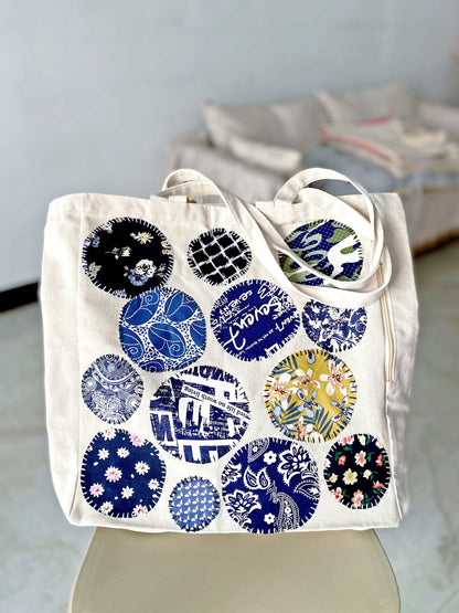 Multi-purpose sustainable bag with handcrafted patchwork that complements an intentional life focused on quality and waste reduction.