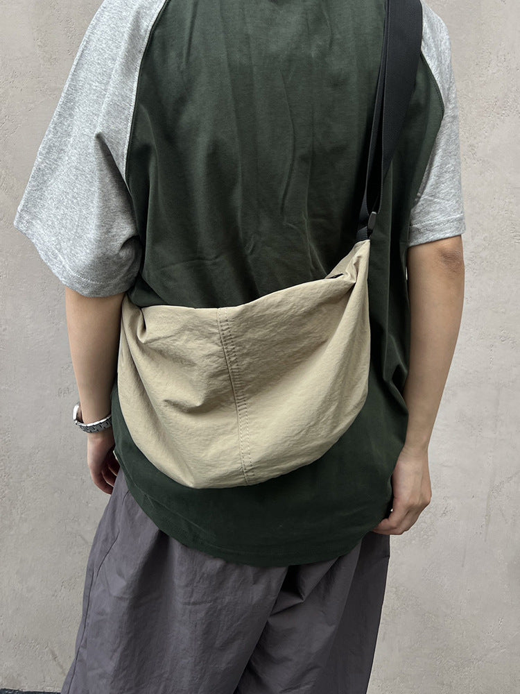 Unisex sling pouch for everyday essentials