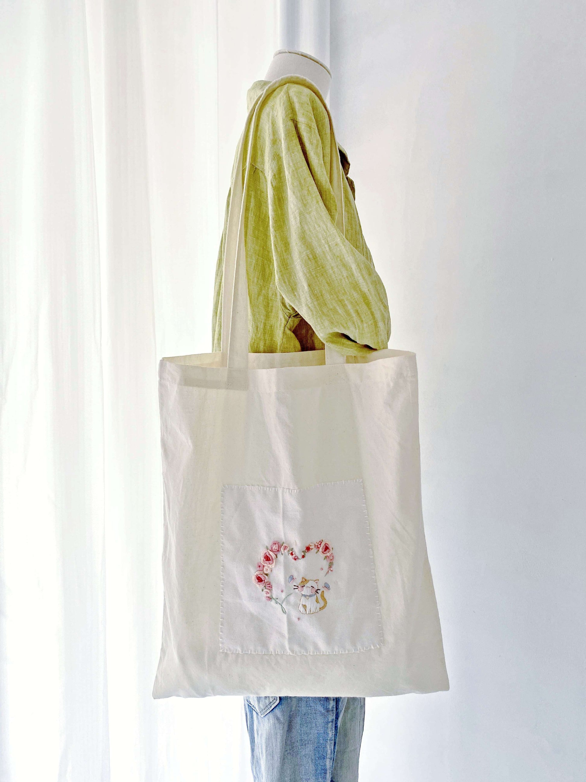 Unique hand-embroidered kitty tote gift for a cat lover who values eco-friendly living.