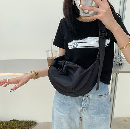 Minimalist crescent shoulder bag for relaxed weekend walks