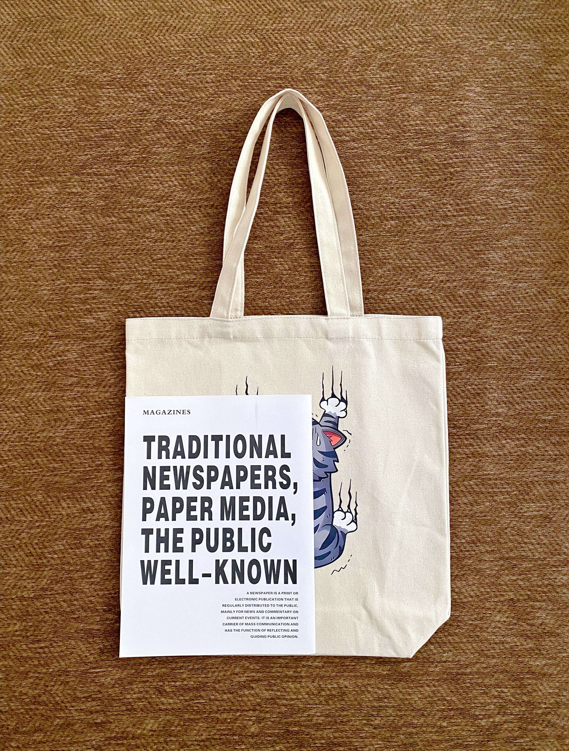 simple everyday bag with a soft structure and hand-printed kitten graphic
