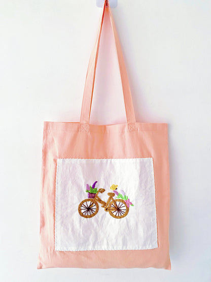 Large-capacity orange tote perfect as a unique graduation or library bag.