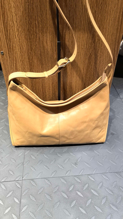 Washed leather handbag with gold-tone hardware for casual outings