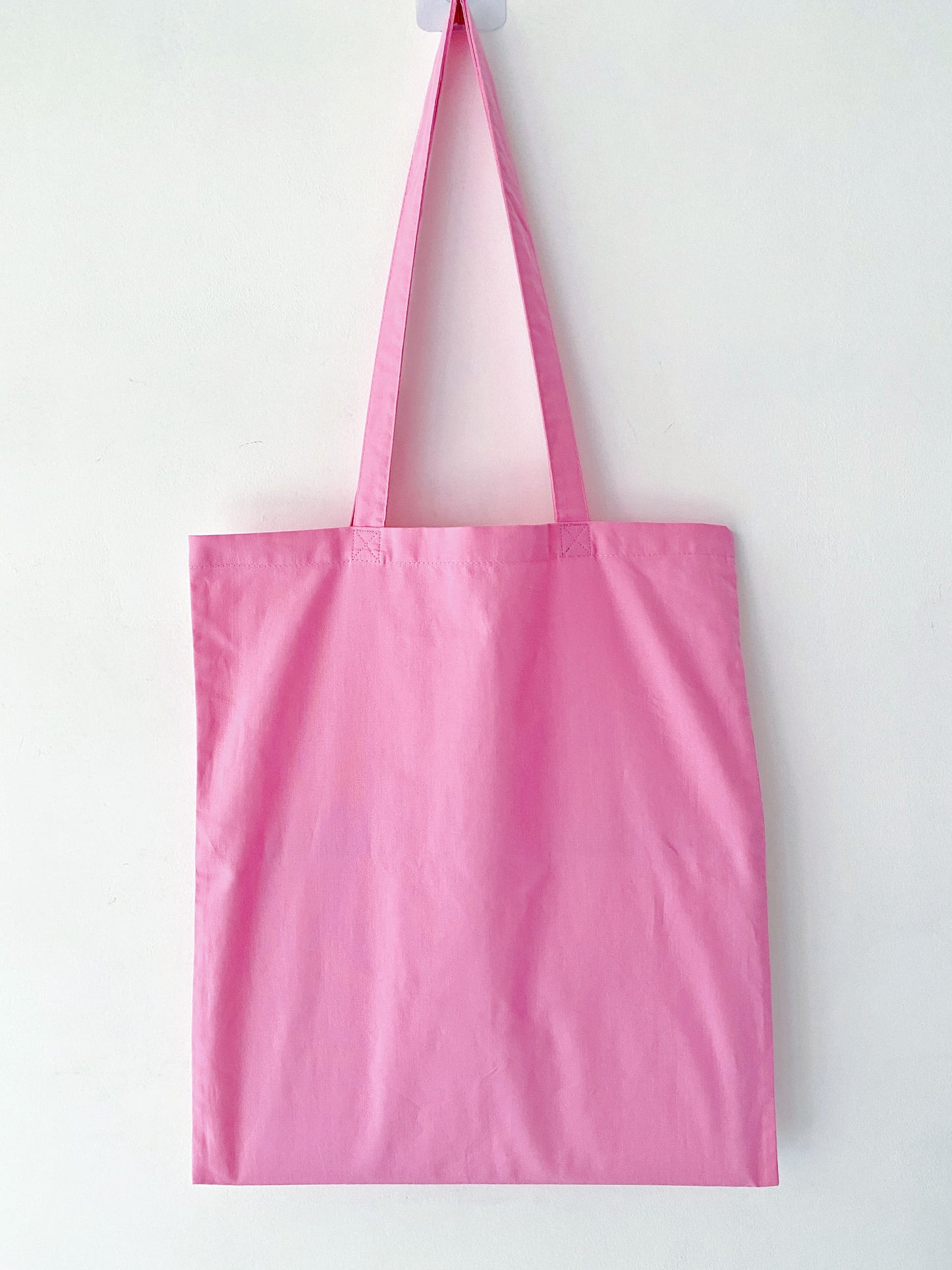 High-quality cotton fabric bag with a durable hand-stitched motif