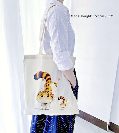 A lightweight, soft cotton tote with a cute orange cat print—ideal for anyone who loves sustainable fashion and fun gifts.