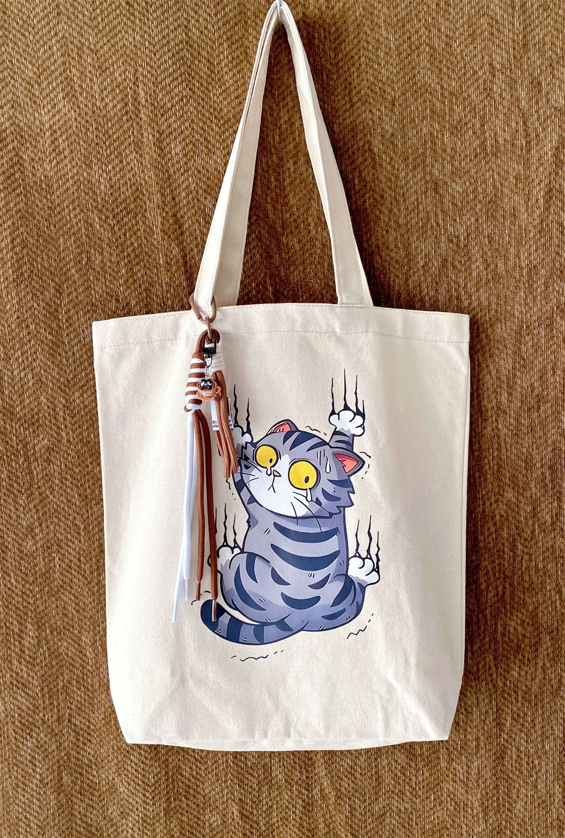 minimal canvas tote with hand-printed cat design for quiet city days