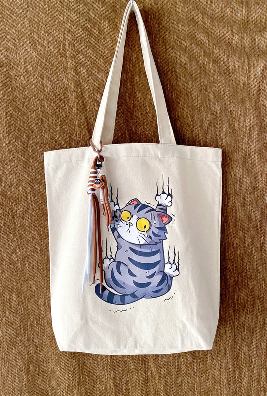 minimal canvas tote with hand-printed cat design for quiet city days