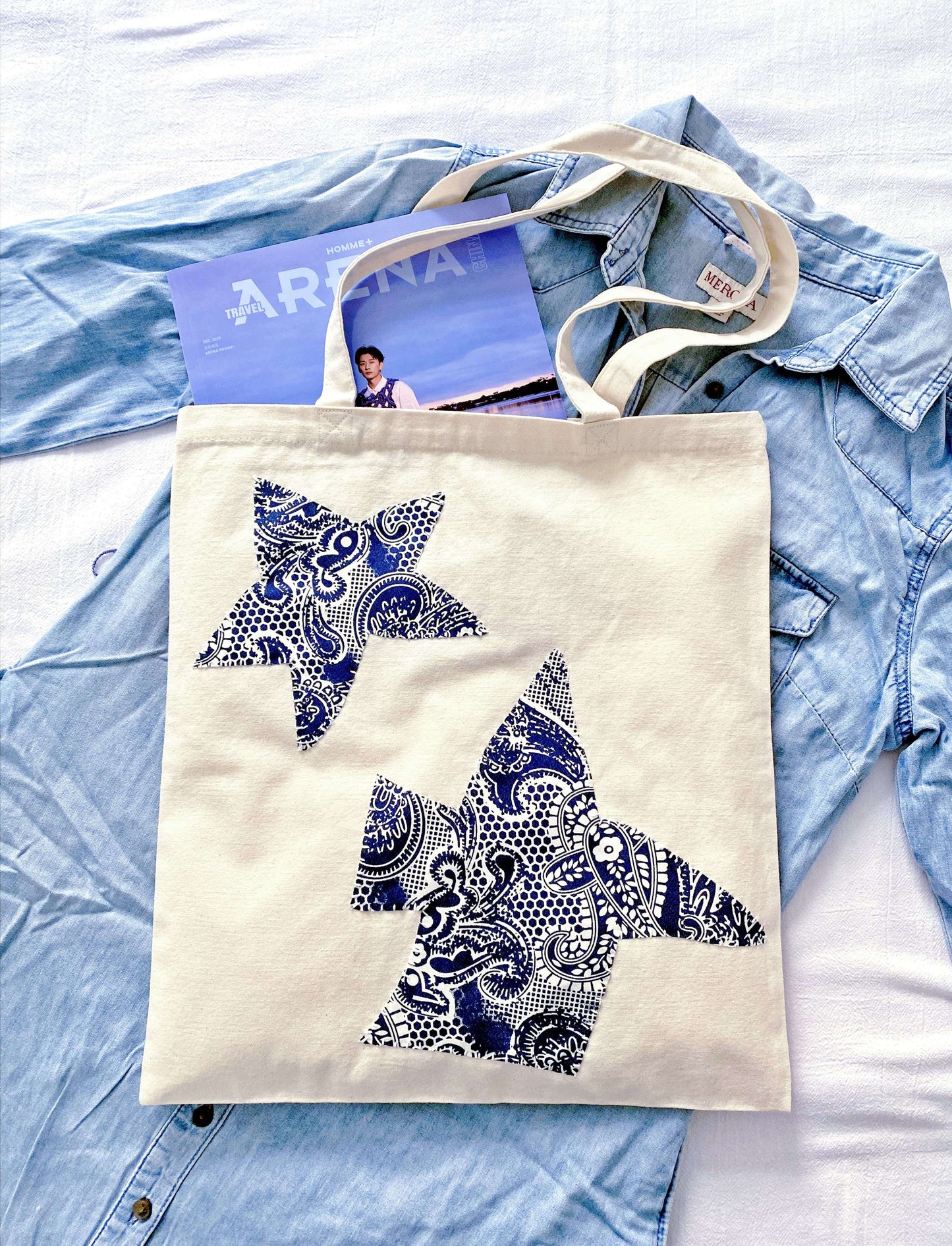 Spacious minimalist bag made from sustainable natural fibers styled for a weekend flower market.