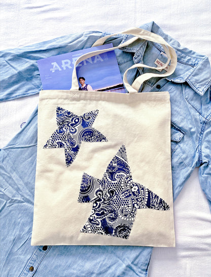 Spacious minimalist bag made from sustainable natural fibers styled for a weekend flower market.