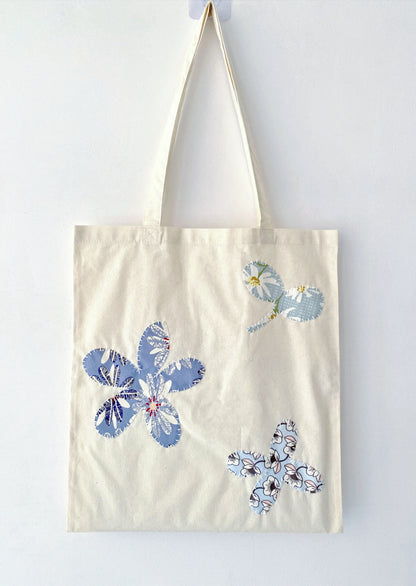 Bohemian-style cotton bag for carrying books or groceries, emphasizing comfort.