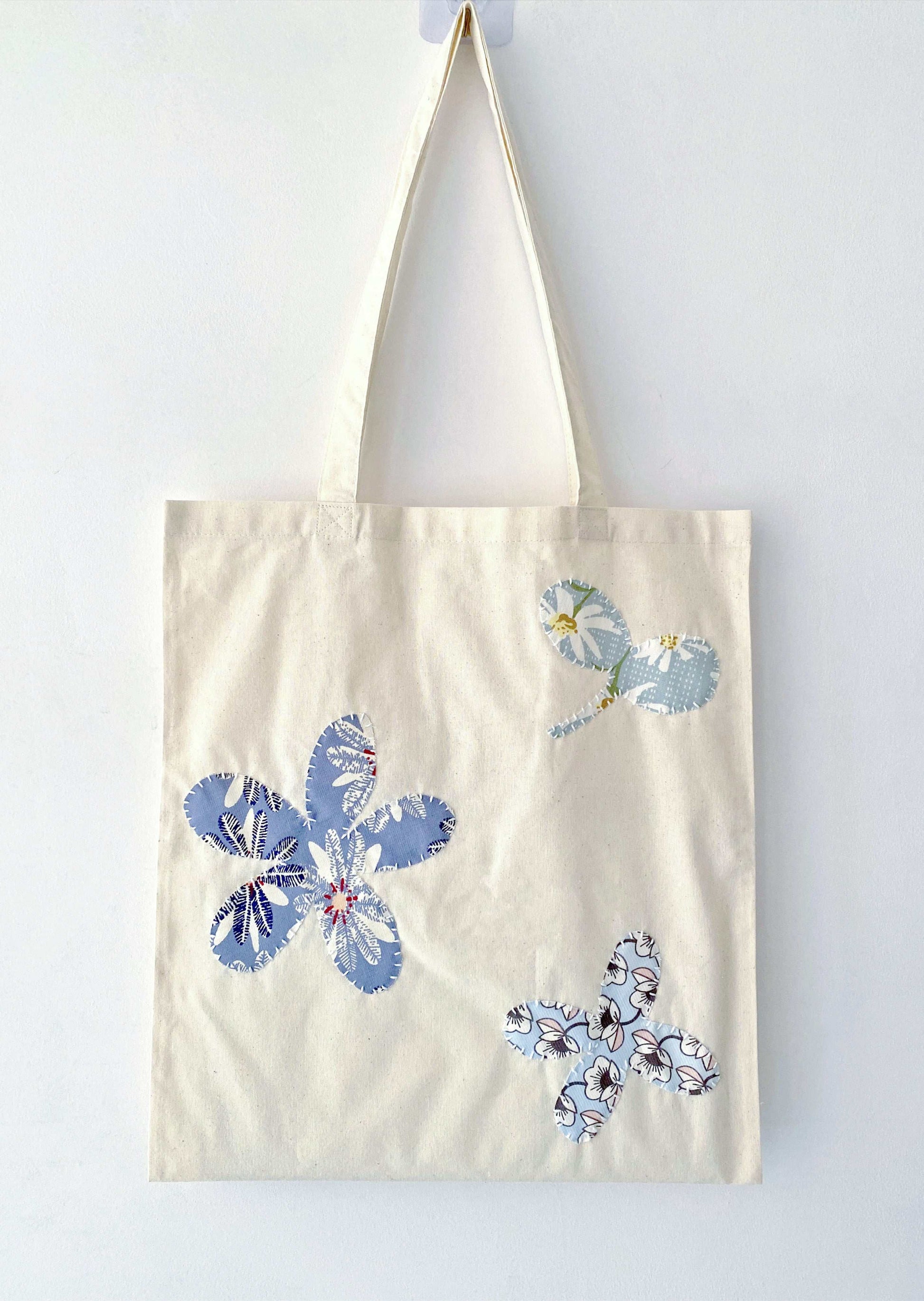 Soft cotton tote with hand-stitched patchwork detail, often chosen as a meaningful gift for friends who appreciate sustainable living and quiet design