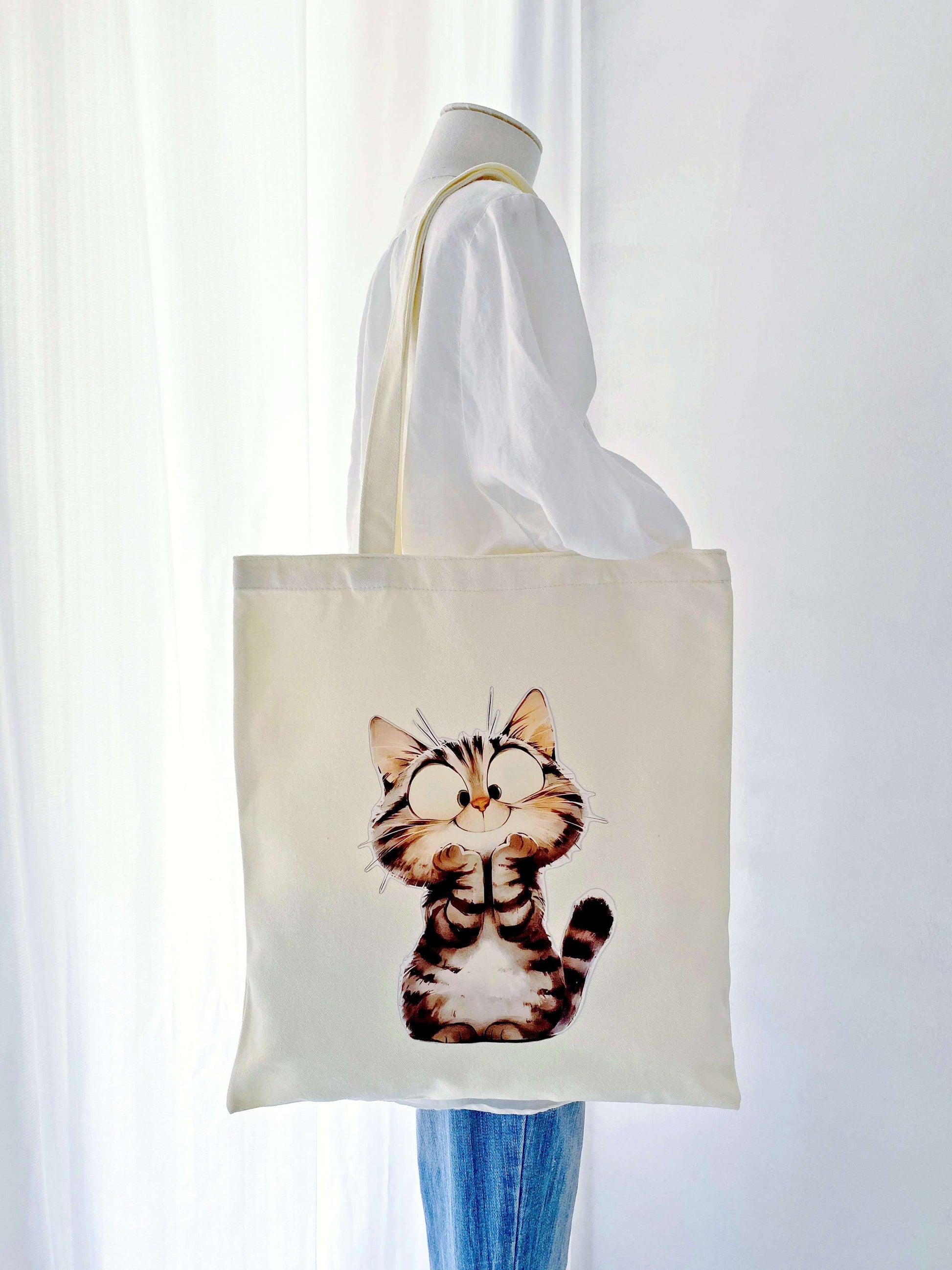 Sustainable canvas shoulder bag with simple cat artwork