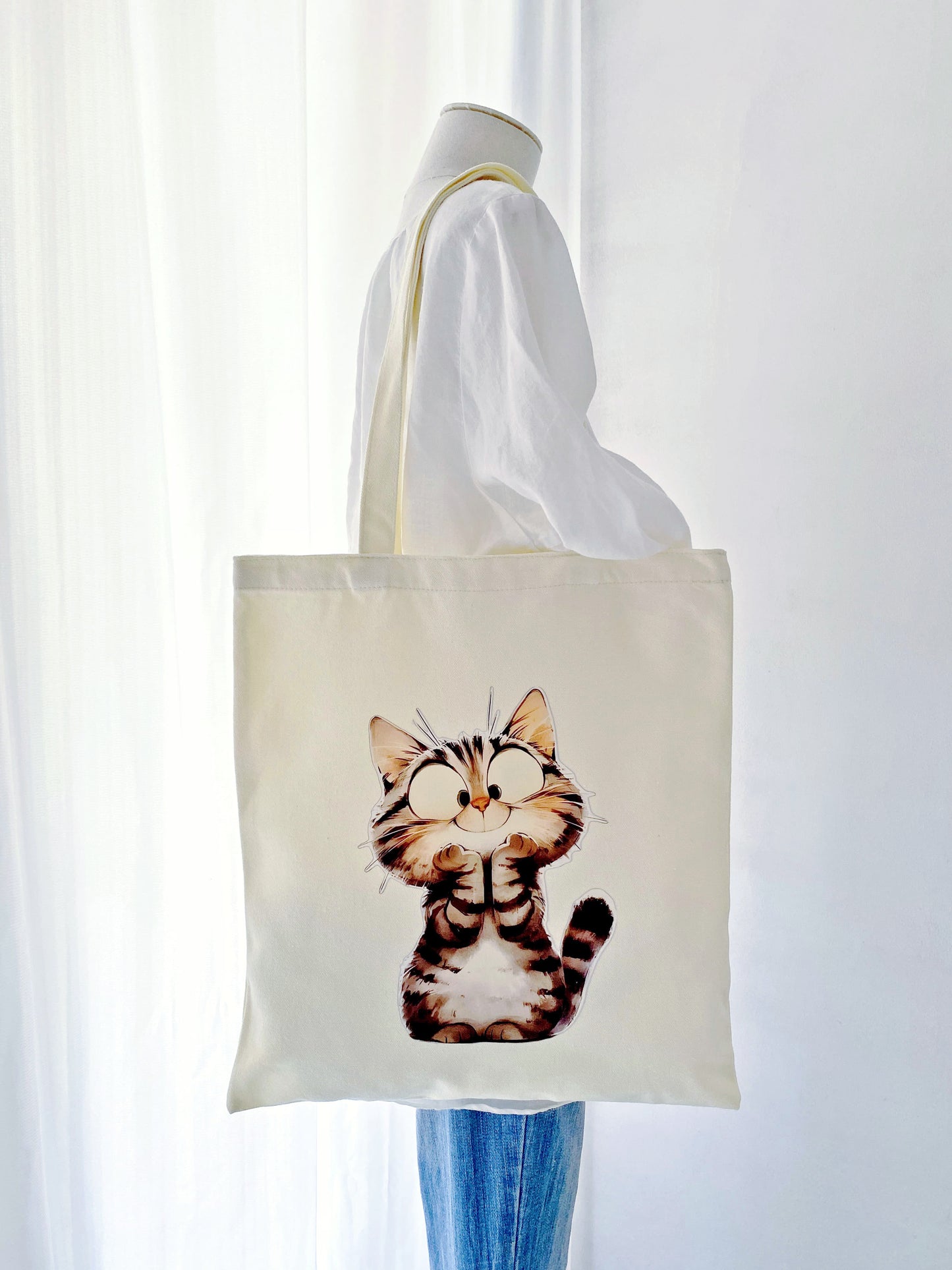 Sustainable canvas shoulder bag with simple cat artwork