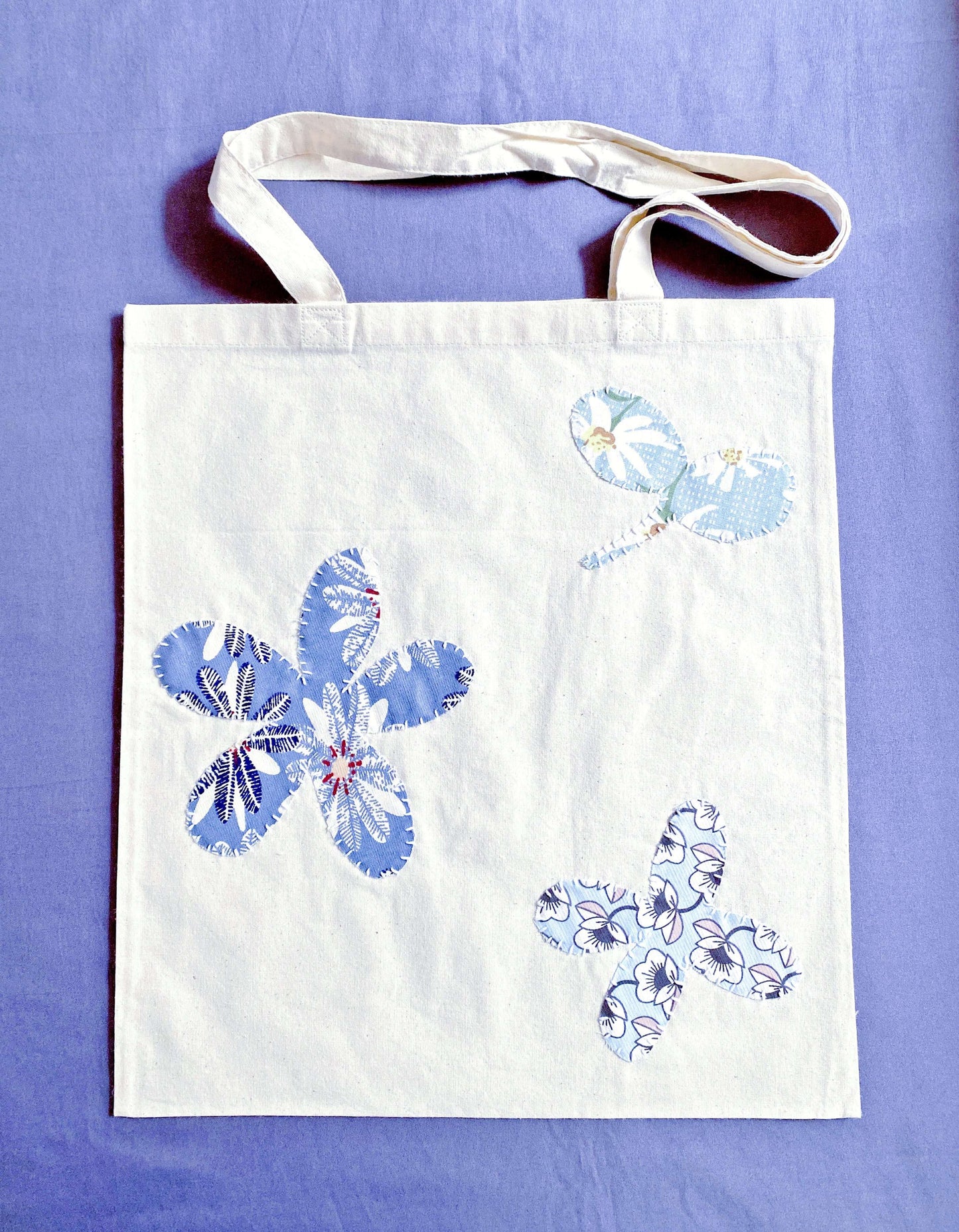 Soft cotton tote with hand-stitched patchwork detail, often chosen by Europeans who prefer lightweight bags that feel calm, practical, and aligned with sustainable daily routines