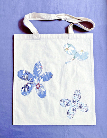 Soft cotton tote with hand-stitched patchwork detail, often chosen by Europeans who prefer lightweight bags that feel calm, practical, and aligned with sustainable daily routines