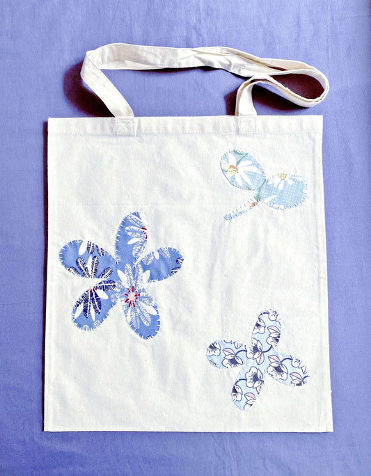 Soft cotton tote with hand-stitched patchwork detail, often chosen by Europeans who prefer lightweight bags that feel calm, practical, and aligned with sustainable daily routines