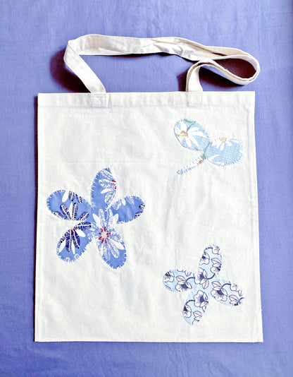 Soft cotton tote with hand-stitched patchwork detail, often chosen by Europeans who prefer lightweight bags that feel calm, practical, and aligned with sustainable daily routines