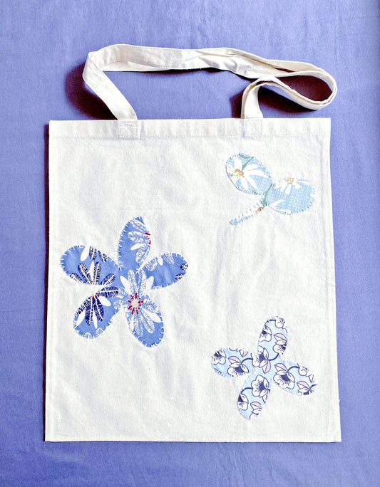 Soft cotton tote with hand-stitched patchwork detail, often chosen by Europeans who prefer lightweight bags that feel calm, practical, and aligned with sustainable daily routines