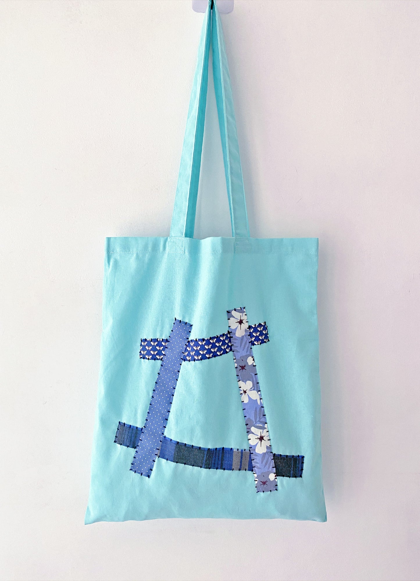 Woman carrying a slouchy oversized fabric bag for a relaxed weekend market stroll