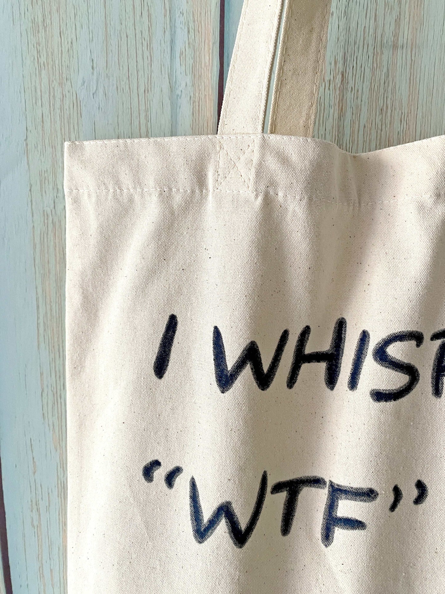 natural canvas tote bag with unique hand-lettered design for sustainable living