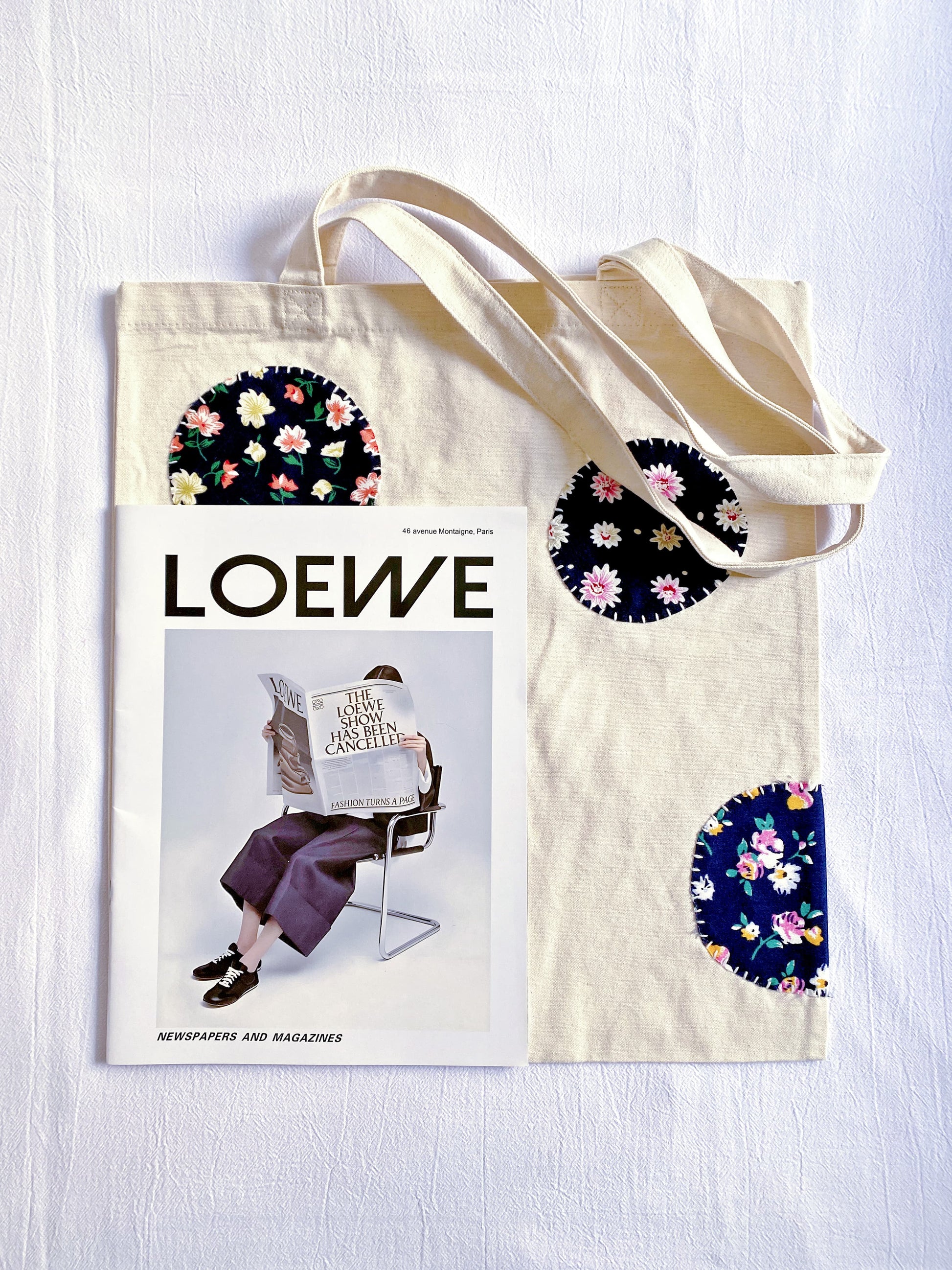 Sustainable canvas tote bag with a relaxed silhouette and decorative patchwork, suitable as a thoughtful everyday gift