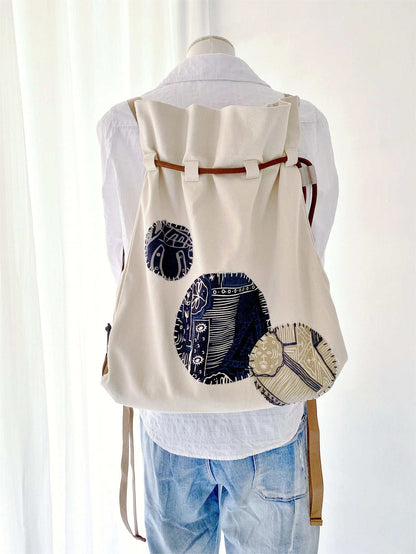 Weekend getaway essentials in large canvas backpack