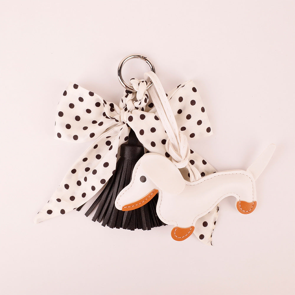 Lightweight fabric bow accessory paired with a summer linen handbag