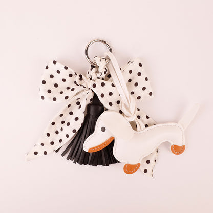 Lightweight fabric bow accessory paired with a summer linen handbag