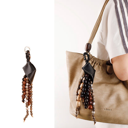 Earth-toned bead decoration suitable for neutral handbags