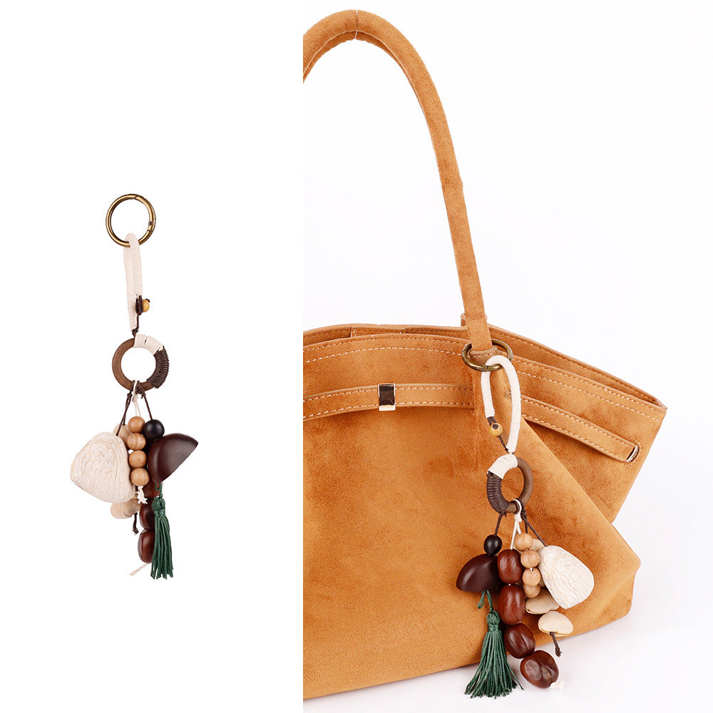 Wood bead pendant with natural fruit shell detail
