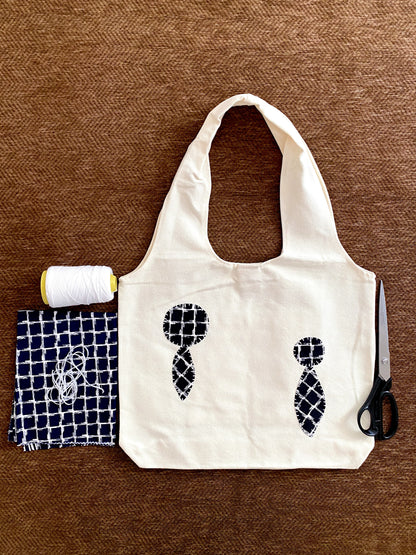 Patchwork detail canvas tote styled as a unique gift for creative lifestyle lovers