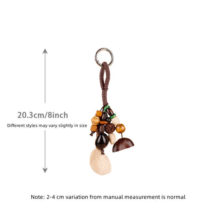 Decorative shell and wood pendant for a casual handbag