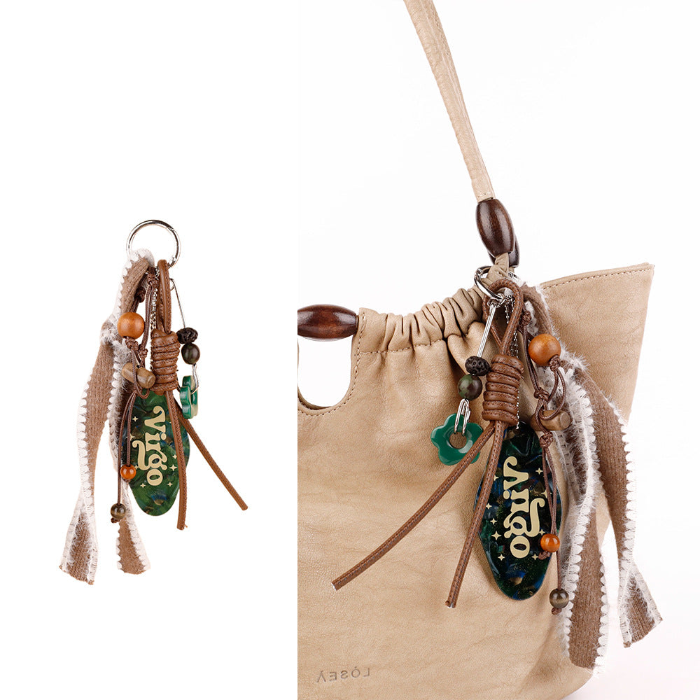 Boho-style keychain charm with natural bead details