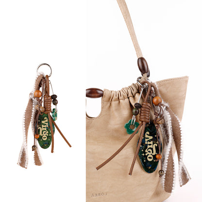 Boho-style keychain charm with natural bead details
