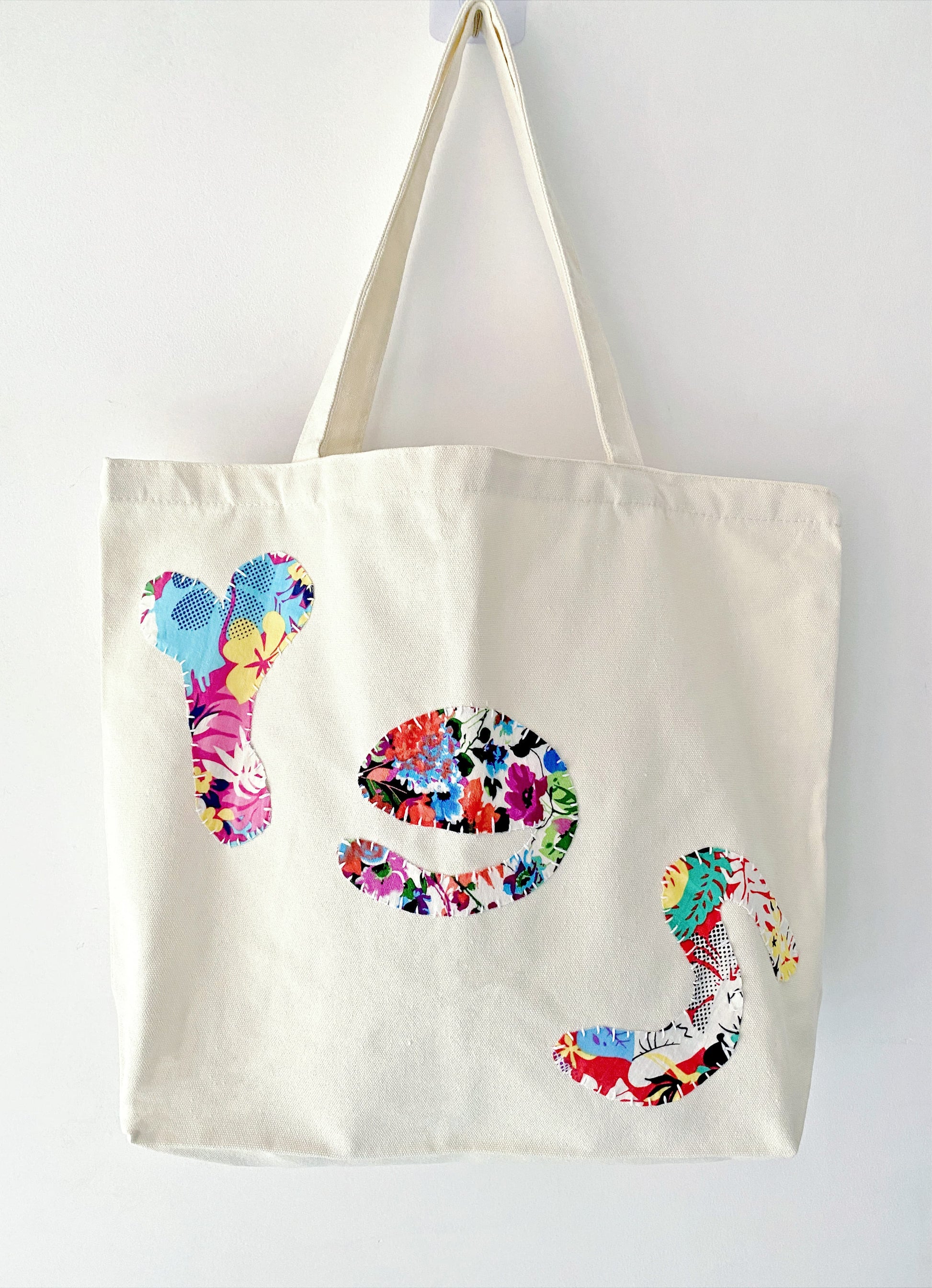 Tote bag with a bold stitched YES letter on the front