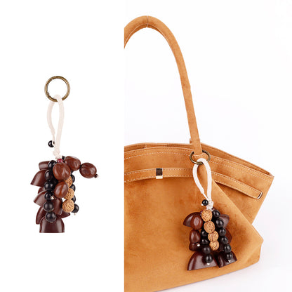 Simple nature inspired charm for daily carry bags
